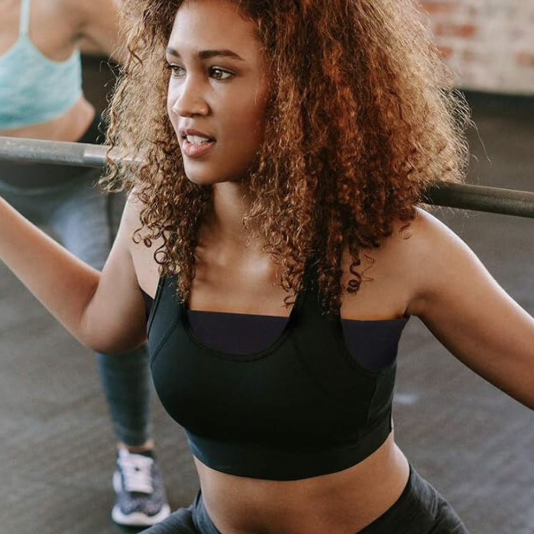 Image of lady wearing the Breast Support Band at the gym