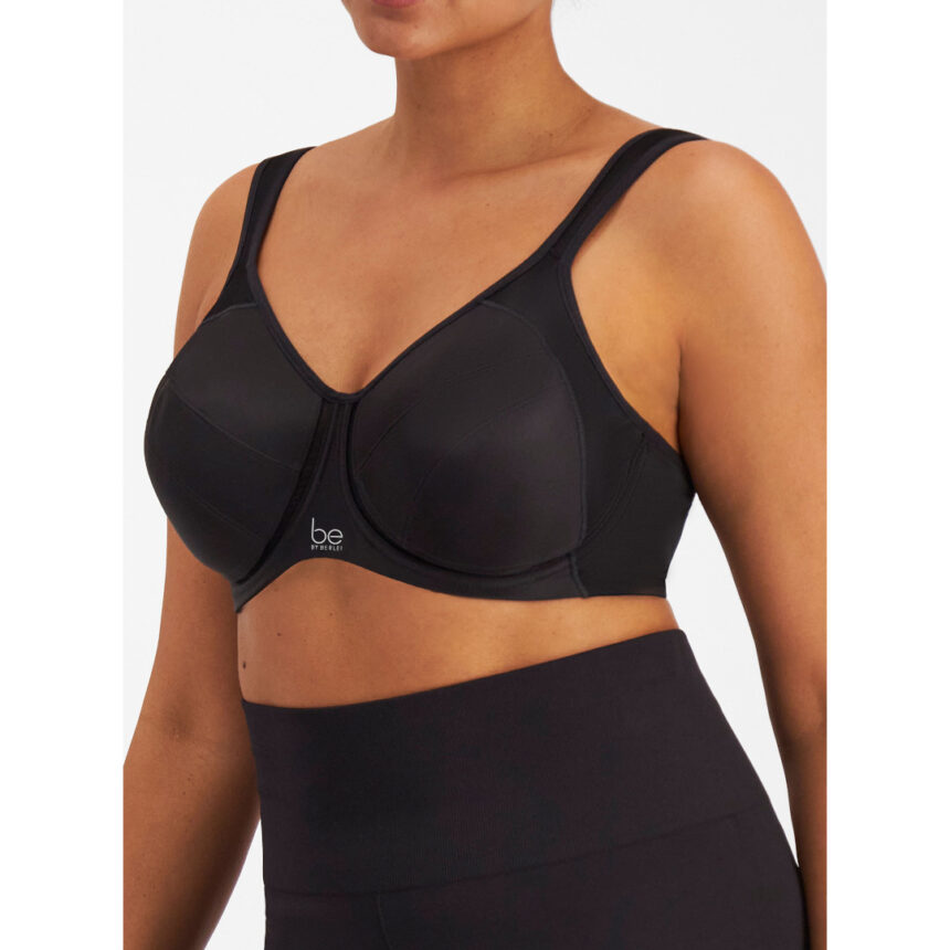 Black sports bra worn by a person on a white background