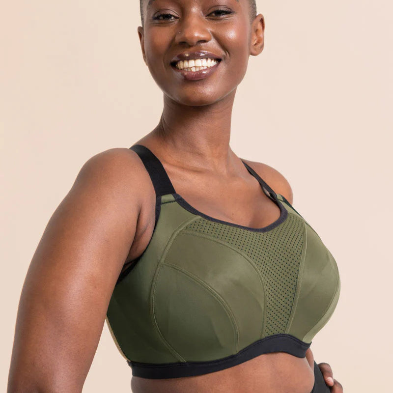Model wearing Curvy Kate sports bra in Green & Black