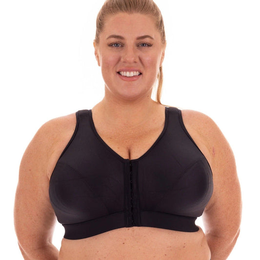 Curvy women wearing Enell Lite bra in colour Black showing front fastening view