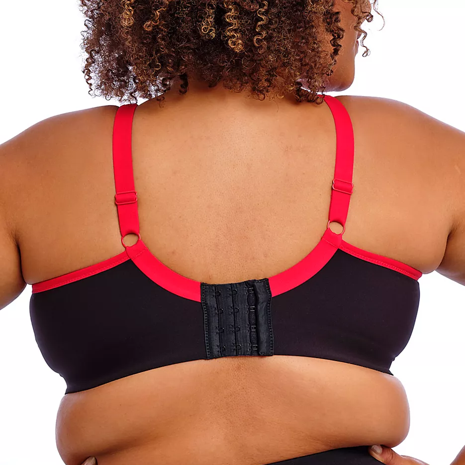 Black sports bra with red straps on a white background