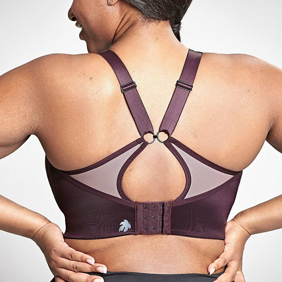 Woman wearing the Royce sports bra showing Racerback style with J clips