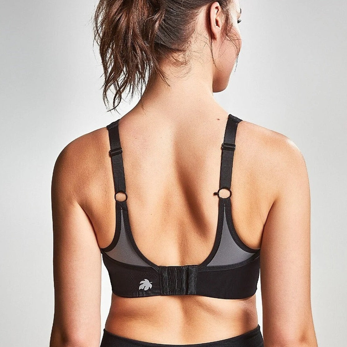 Women showing you the back view of the Royce High Impact sports bra